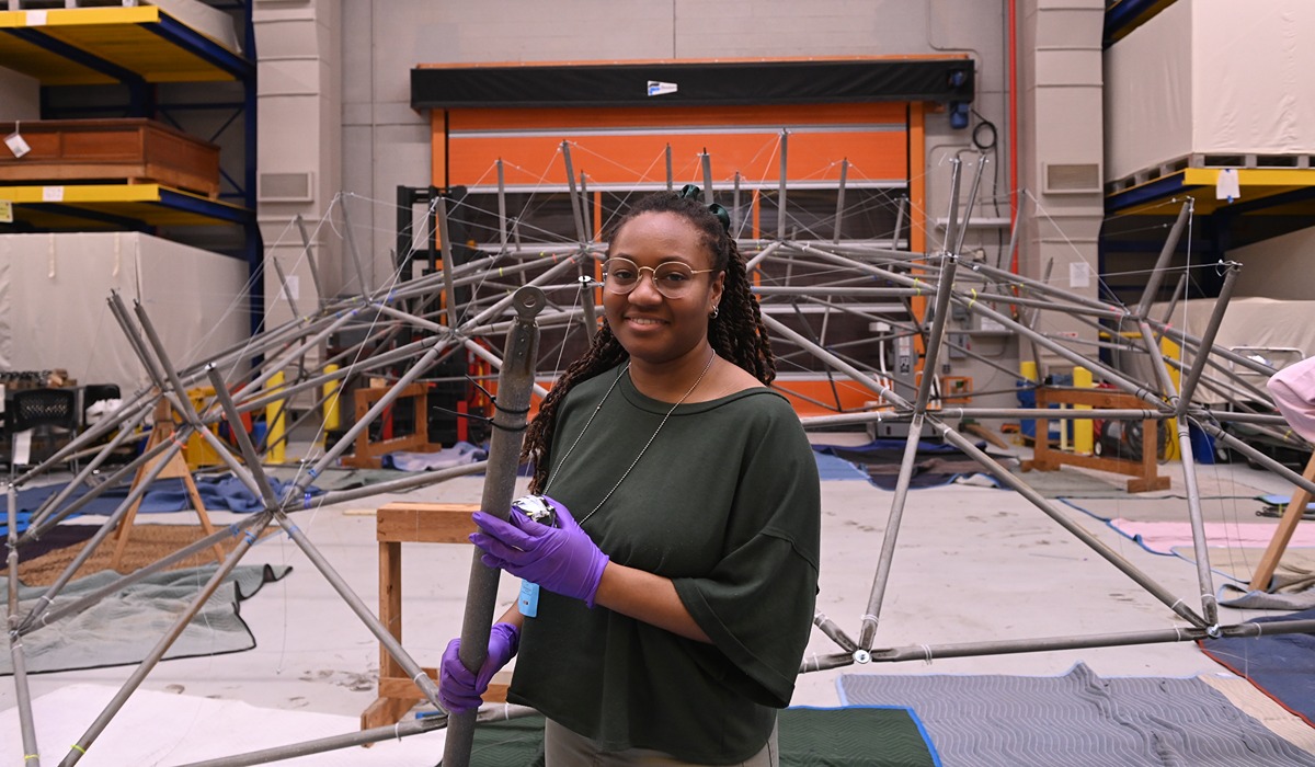 Architecture and net zero design student Adero Brooks is helping to reconstruct the first full-scale geodesic dome erected in North America, thanks to a University partnership with the Smithsonian Institution.