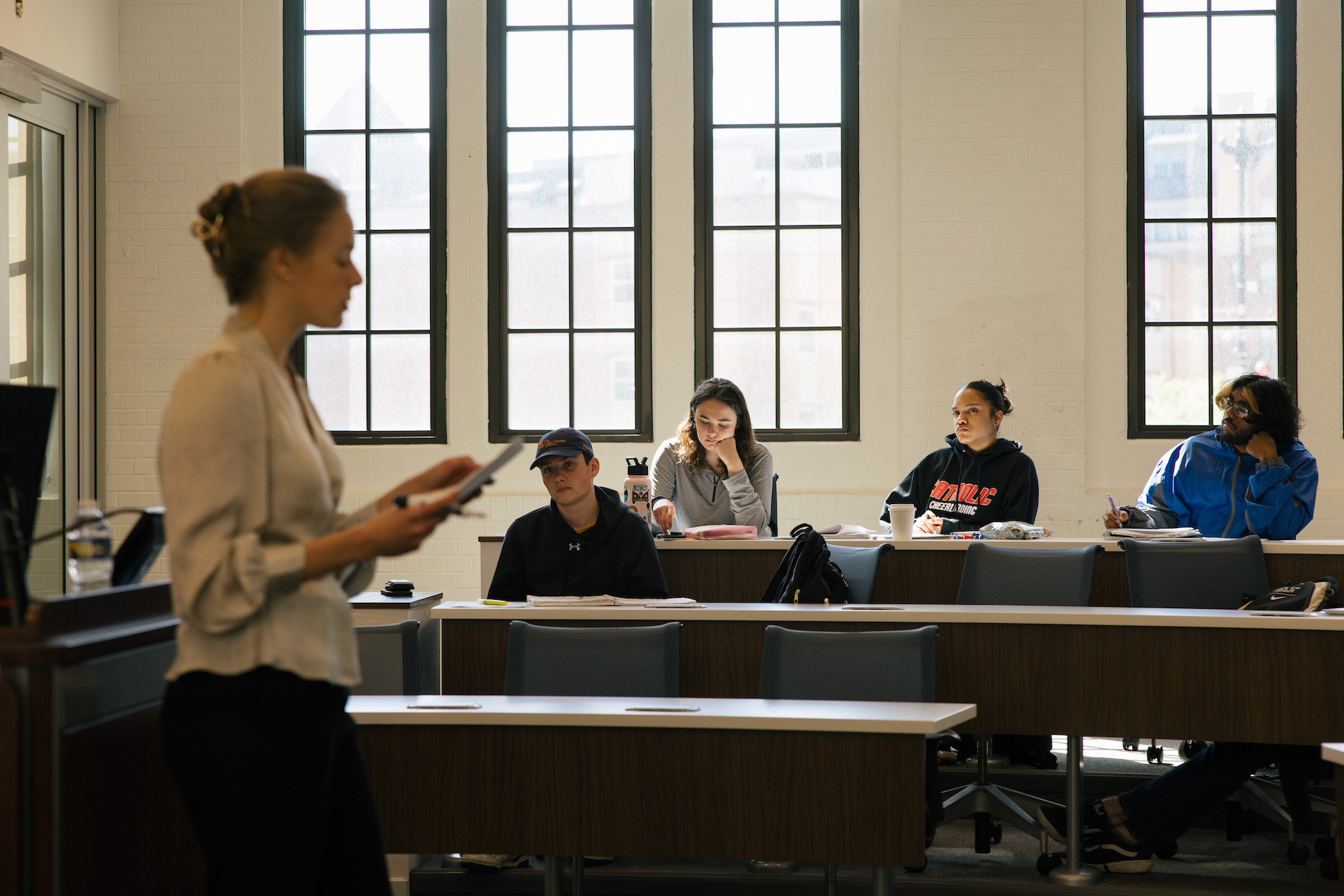 students listening to their professor in class