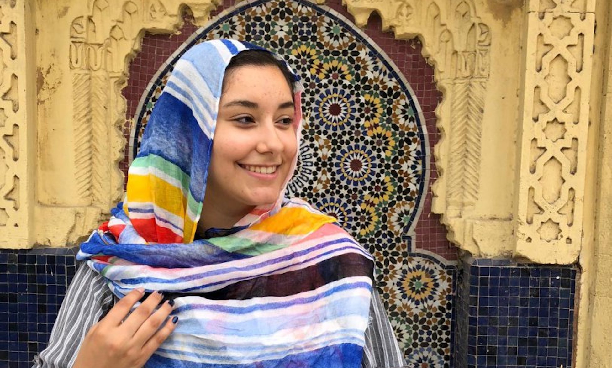 student dressed in a colorful moroccan headcovering