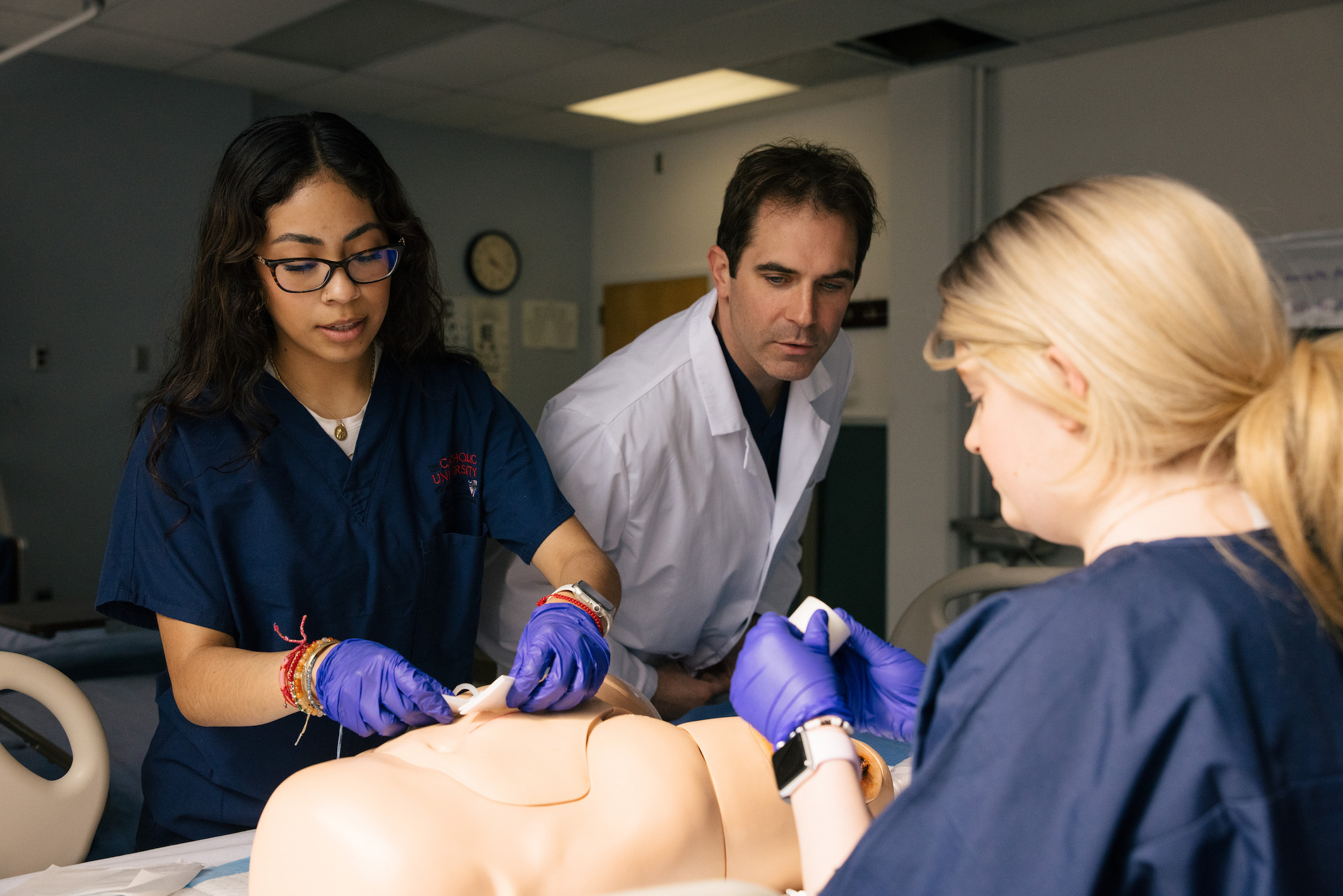 nursing students working on a patient