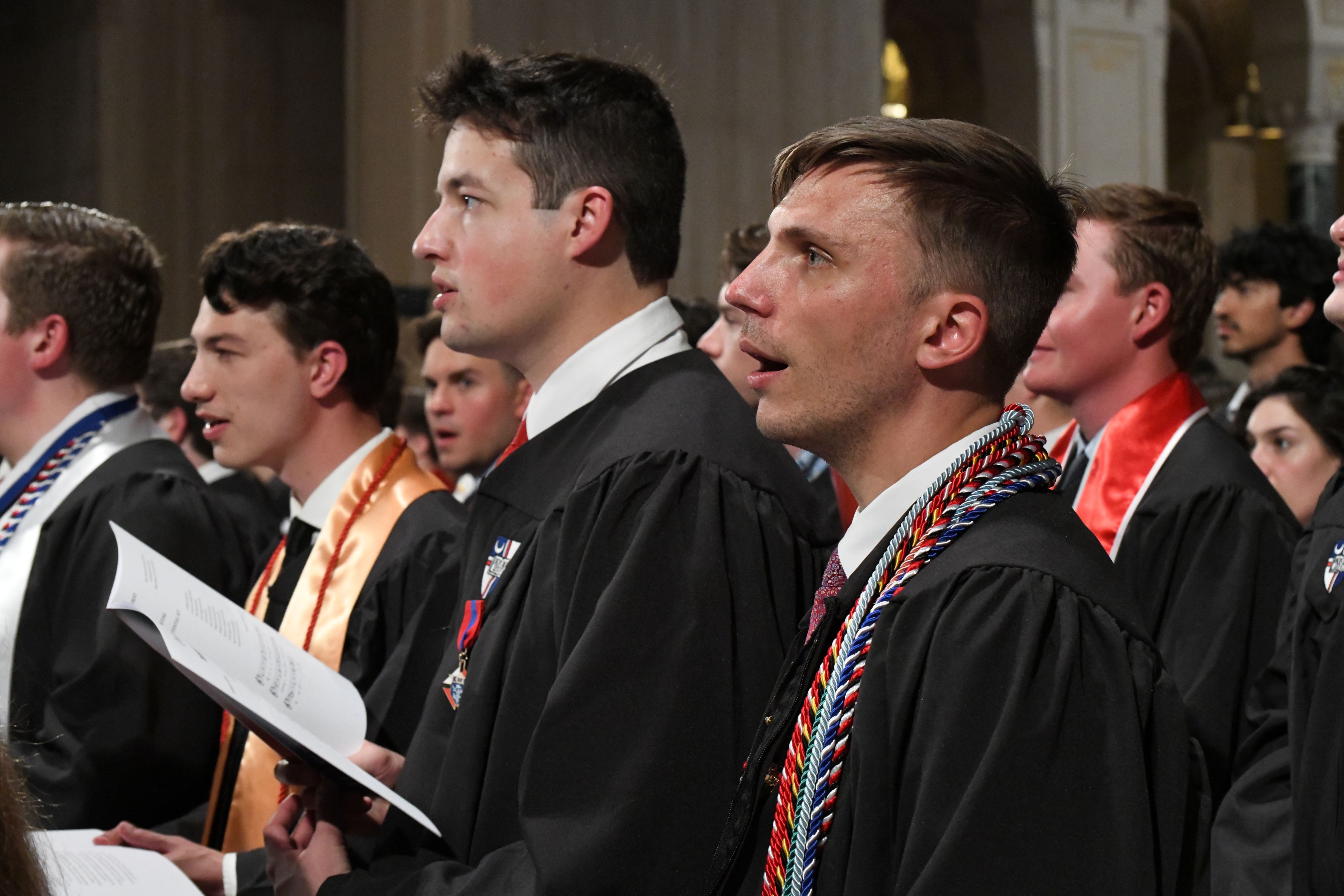 Graduates praying at mass