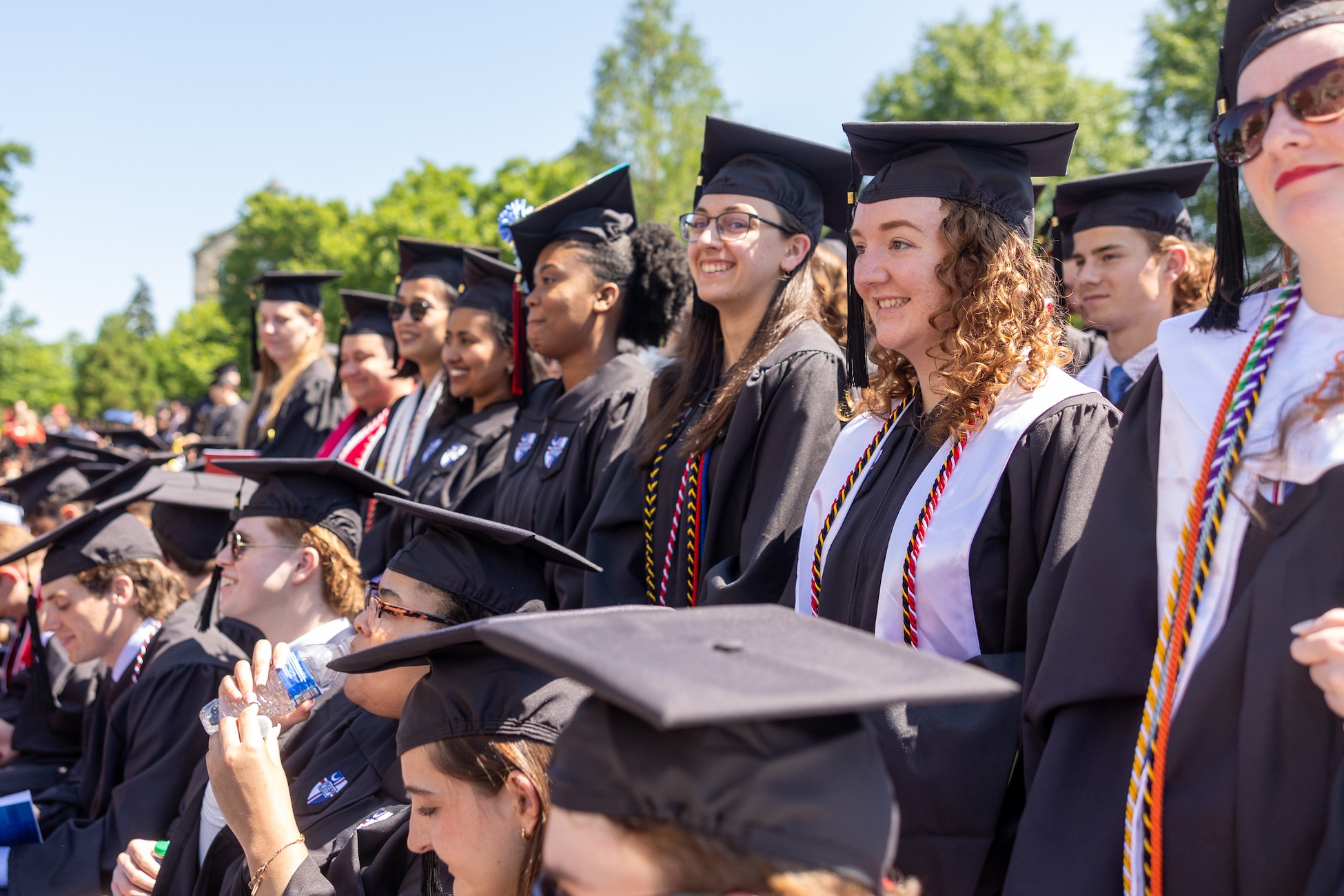 graduates smiling at commencement