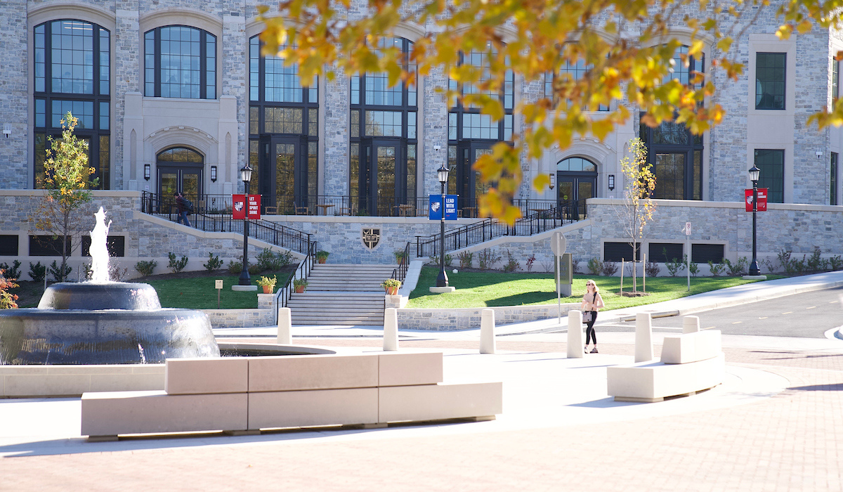 Conway School of Nursing in the fall, surrounded by golden leaves.