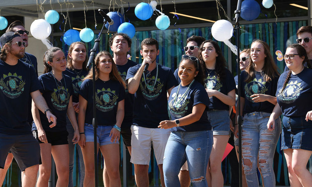 Students singing and performing on campus.