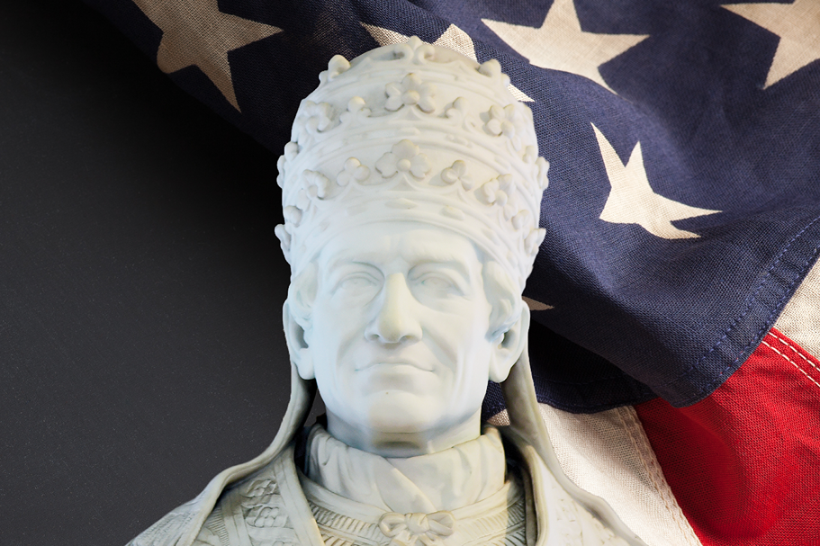 Pope Leo Statue set against an American flag background