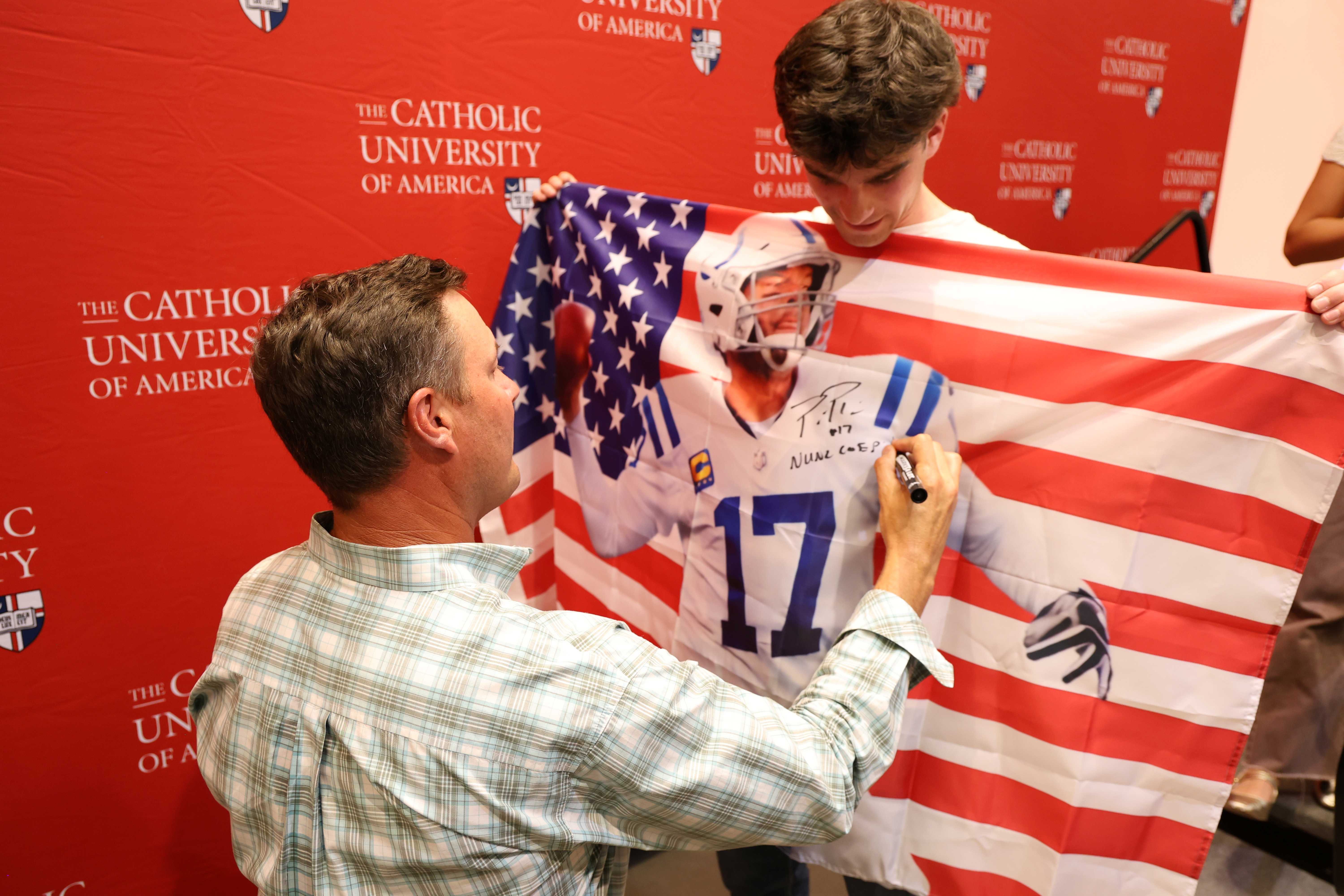 Philip Rivers signs jersey and flag at CUA on Tap
