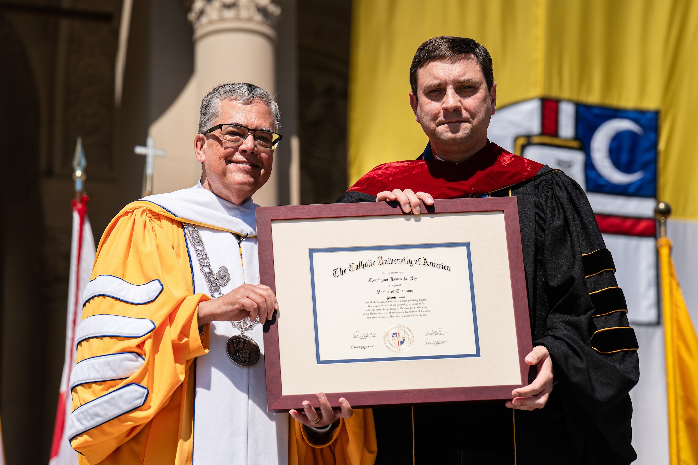 Msgr James Shea receives honorary doctorate from President Peter Kilpatrick