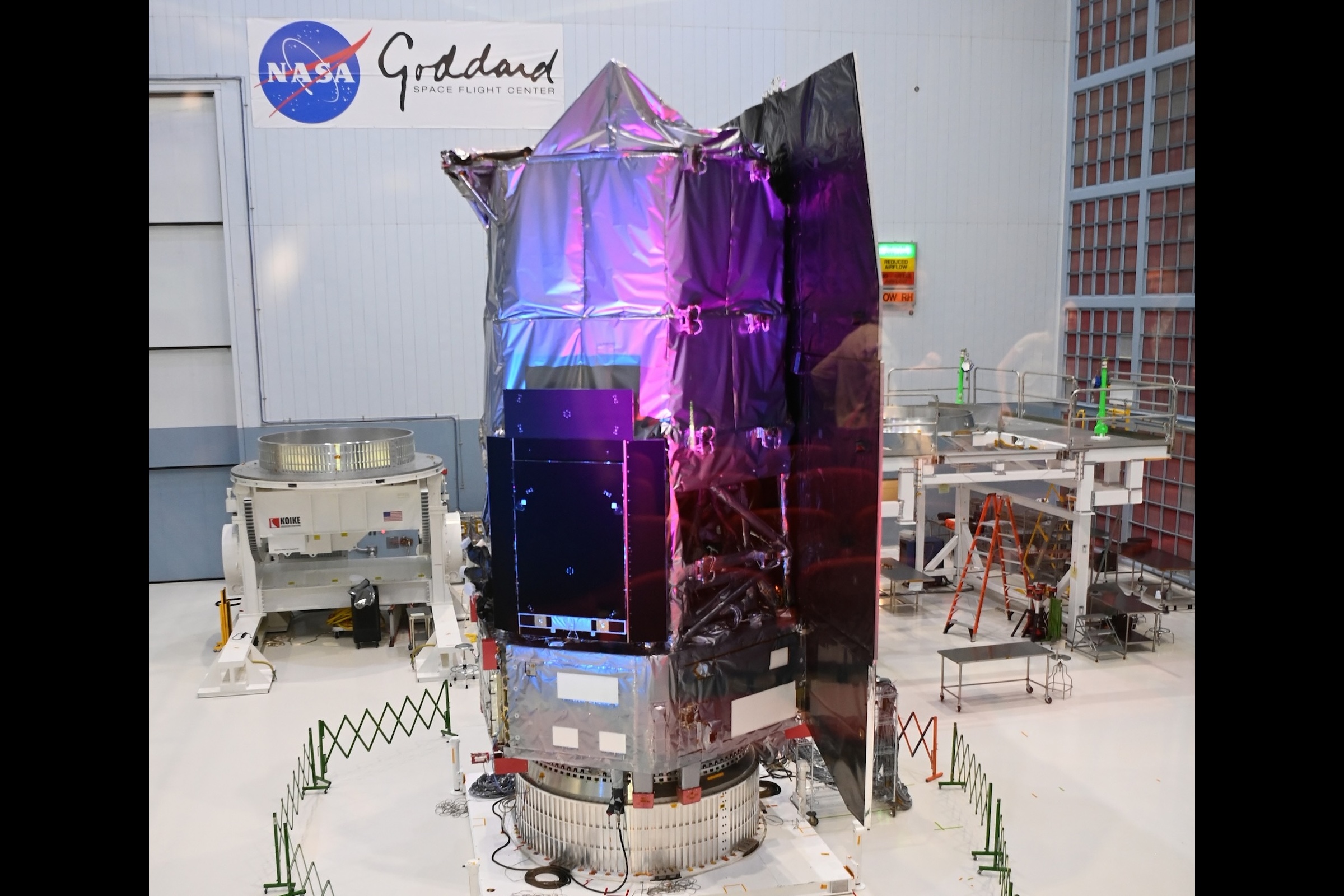 A complete Roman Space Telescope stands inside a clean room at NASA Goddard Space Flight Center 