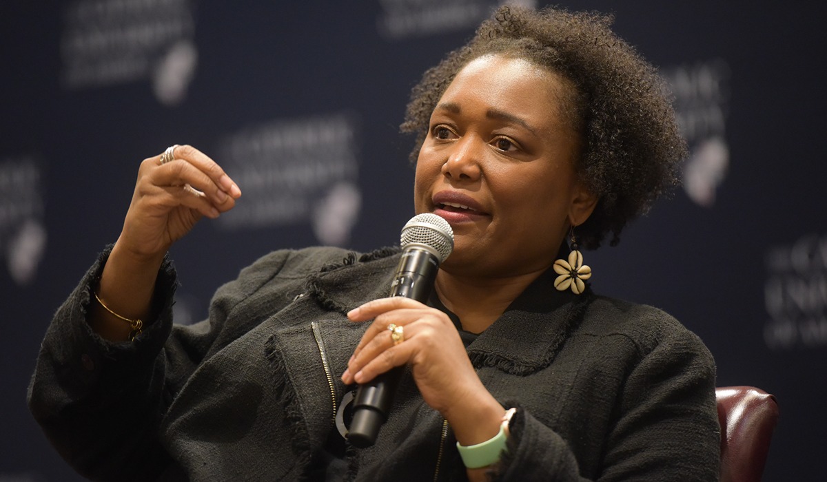 Gloria purvis speaking into a mic