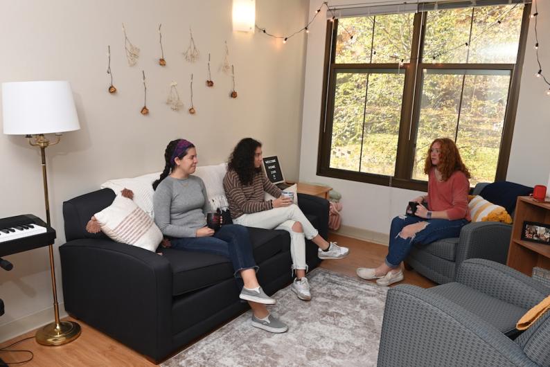 girls chatting in their dorm's living room