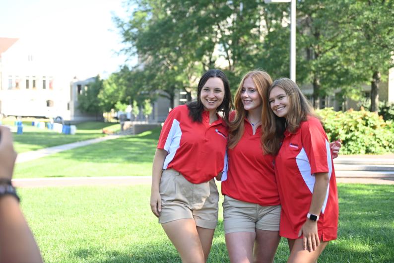 orientation advisors pose for a picture in their orientation uniforms