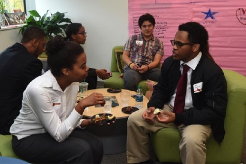 students dicussing something together in the center for cultural engagement office