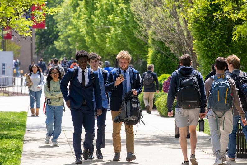 group of male students walking to class together