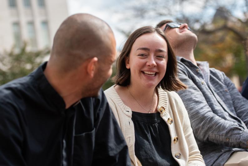 graduate students chatting outdoors