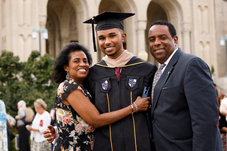 Parents with a proud graduate.