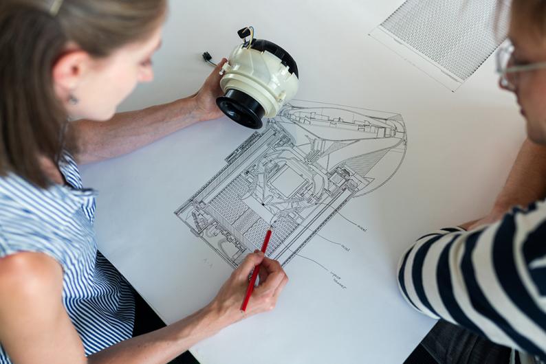two students working on an engineering project