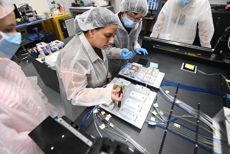 Particle physics engineer Rhea Khatri conducts initial testing of the production process for critical components for the CMS pixel detector at the LHC.