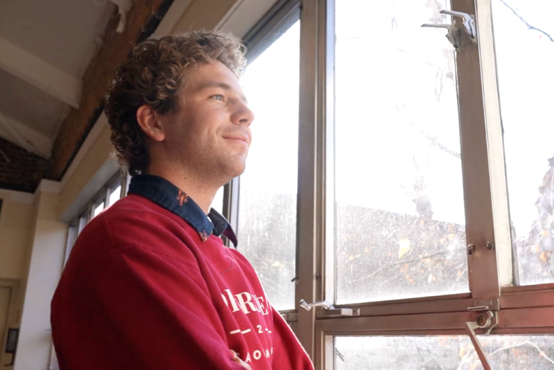 profile of anthony graf looking out the window