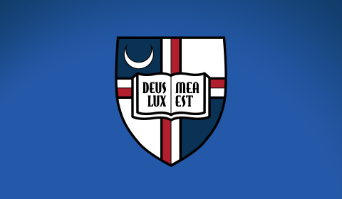 A full color image of the Catholic University shield infront of a gradient blue background.