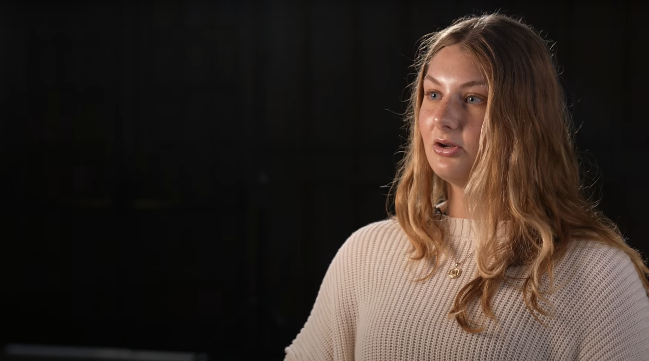 Molly Maxwell video thumbnail, featuring her sitting in Heritage Hall.